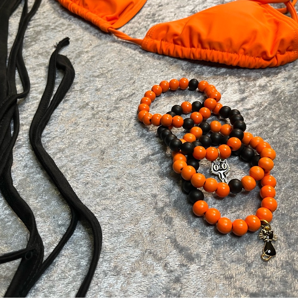 Orange bathing top, 1/2 top and bracelets